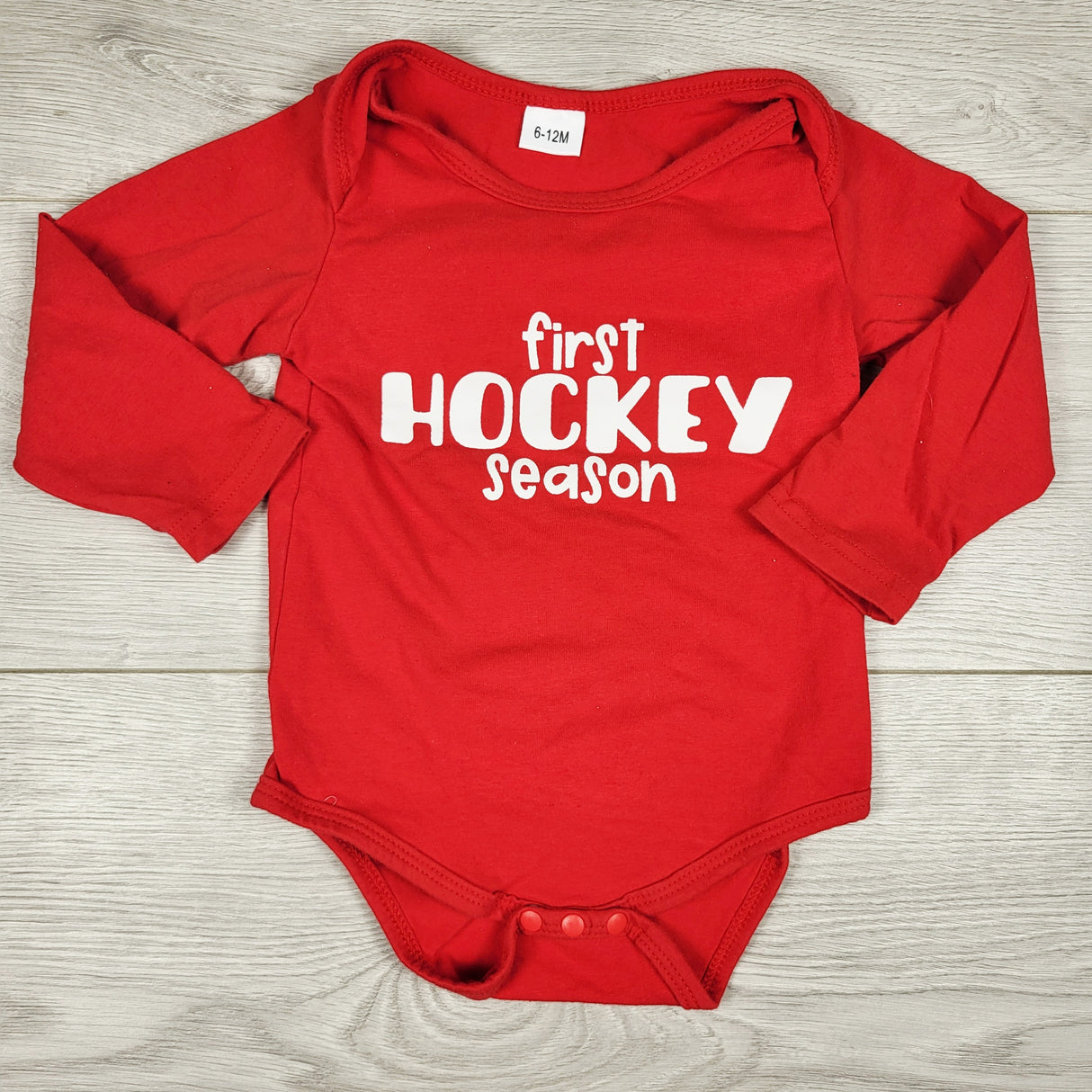 Red "First Hockey Season" bodysuit. Size 6-12 months
