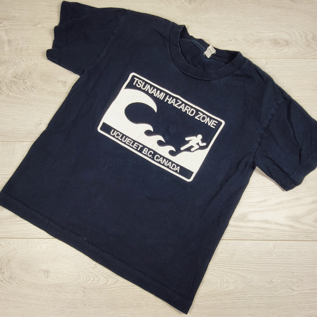 Navy Ucluelet "Tsunami Hazard Zone" t-shirt. Youth size small