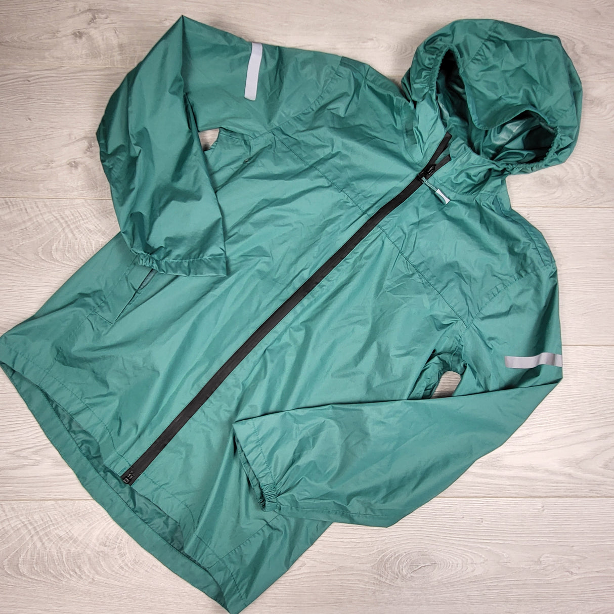 Hema teal green lightweight hooded waterproof jacket. Size 10/12