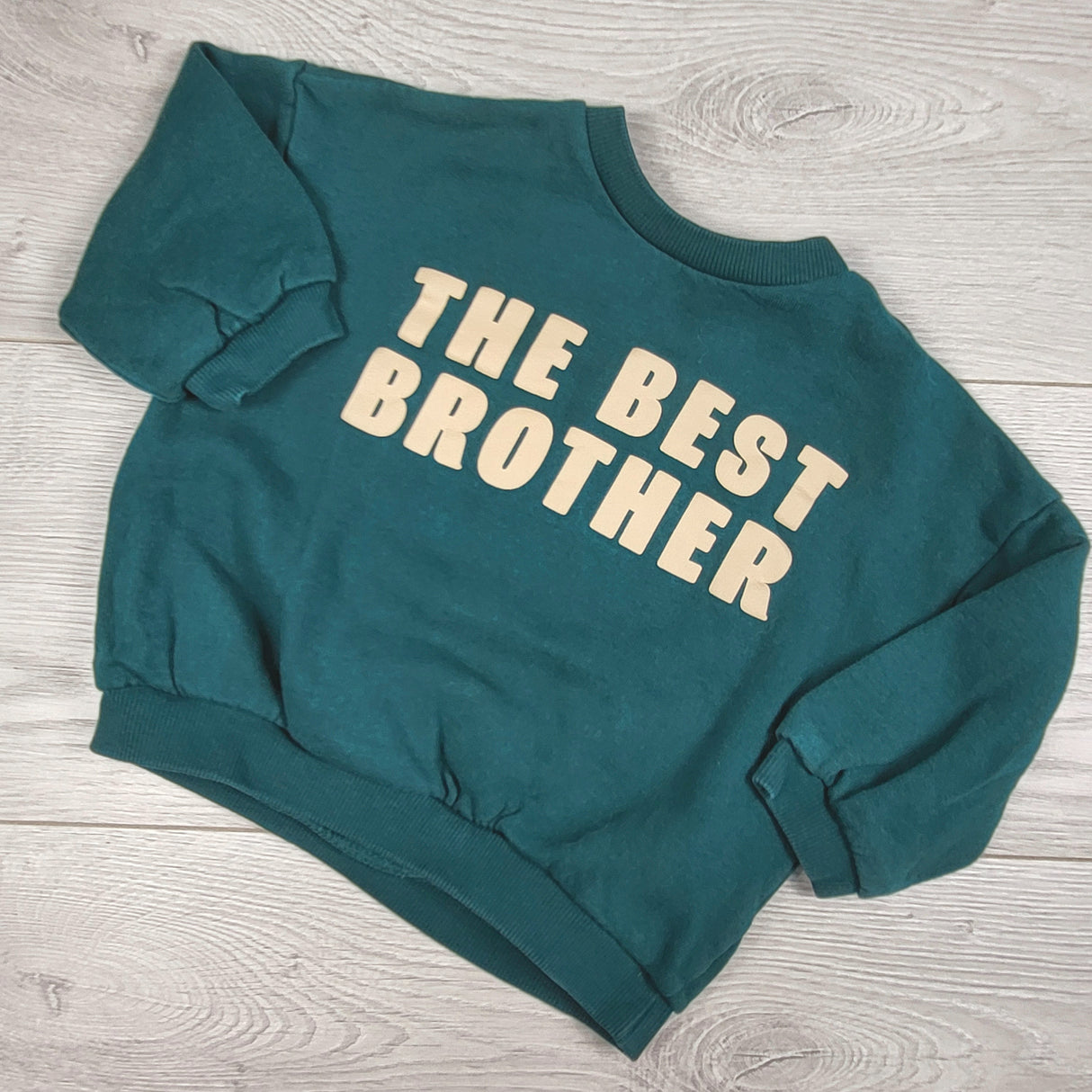 H and M teal green fleecy lined "The Best Big Brother" sweatshirt. Size 9-12 months