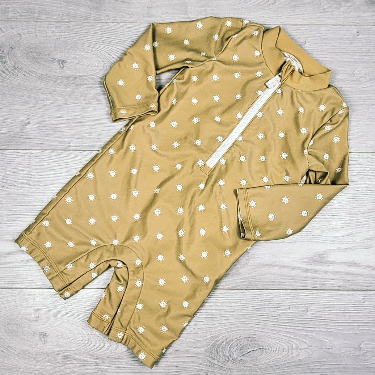 Little Planet honey yellow one piece rash guard with suns. Size 12 months