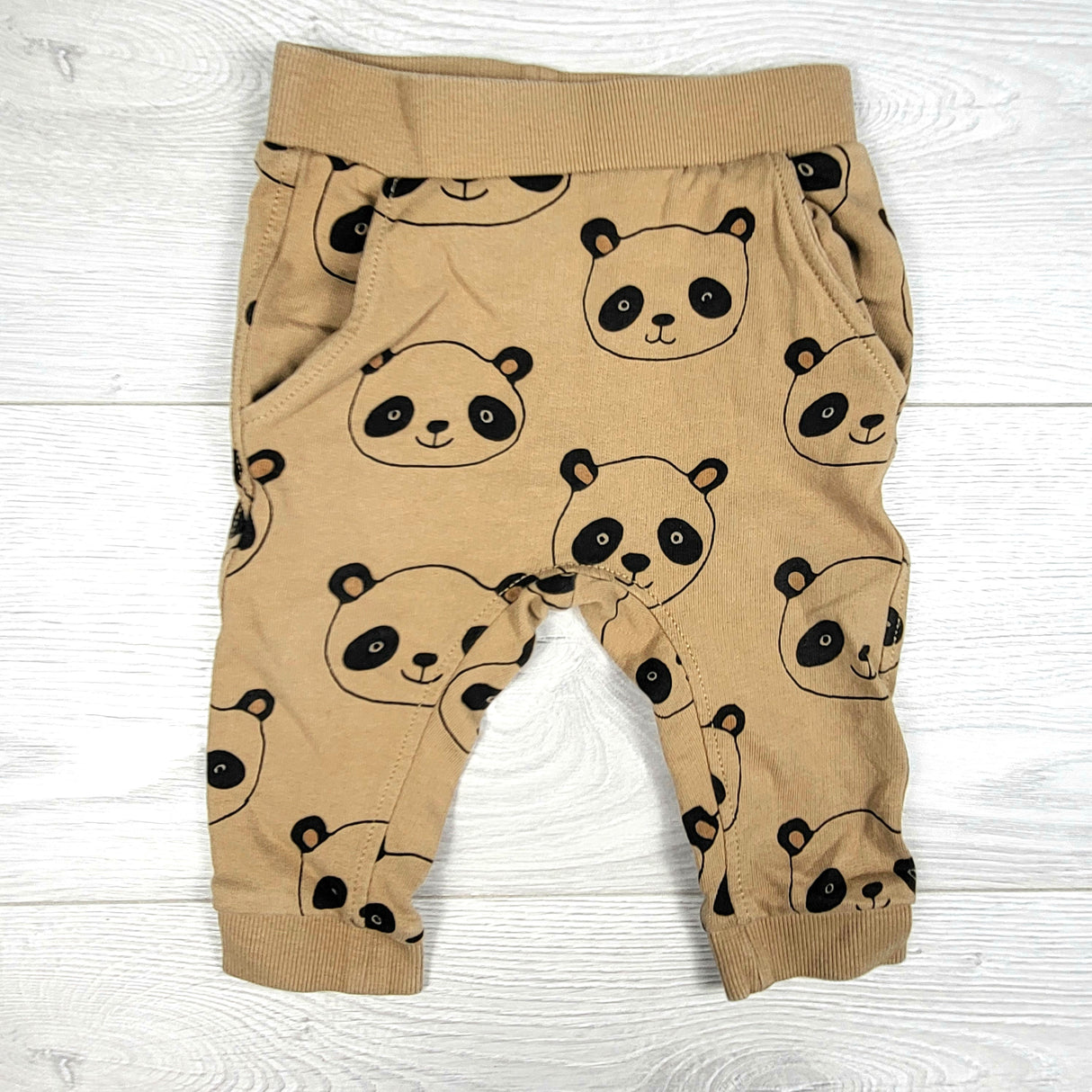 Tan joggers with pandas. Tag cut out but sizes like 0-3 months