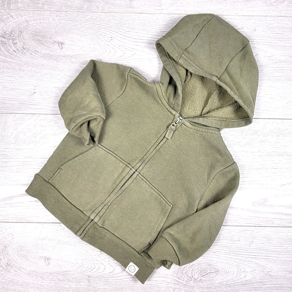 Carters green fleecy lined zip up hoodie. Size 12 months