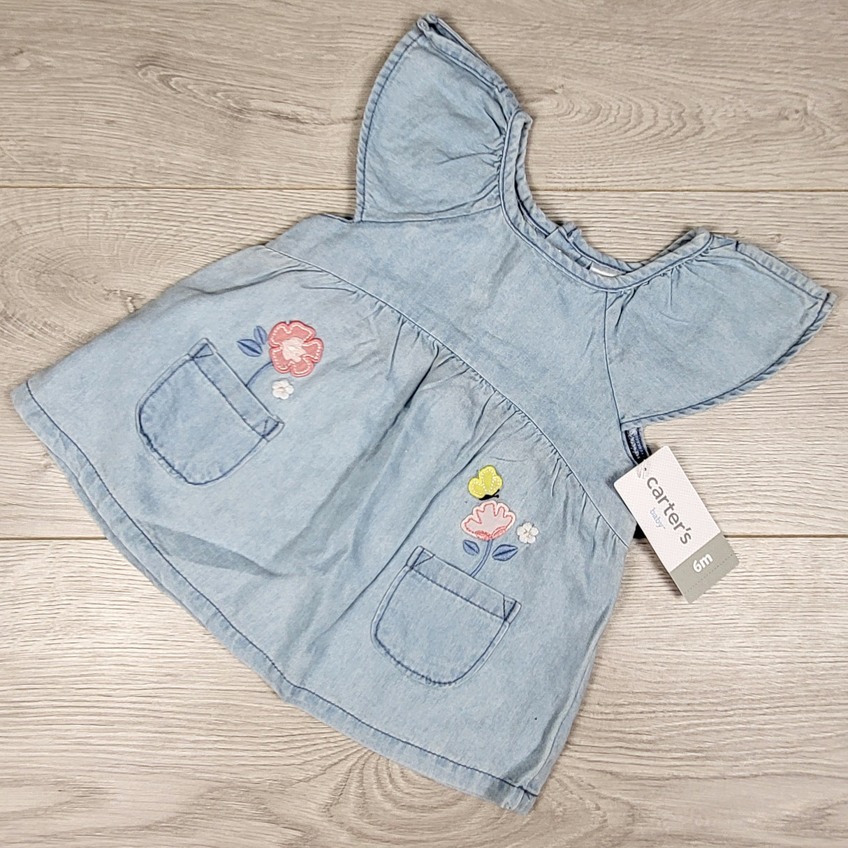 NEW - Carters denim look top with flowers. Size 6 months