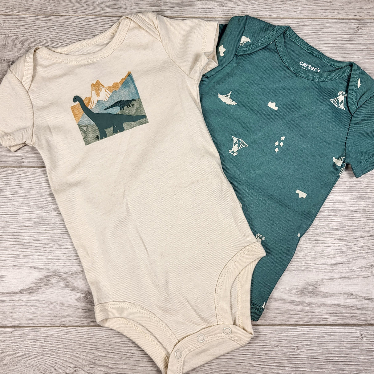 Child of Mine 2pc bodysuit set with dinosaurs. Size 3-6 months