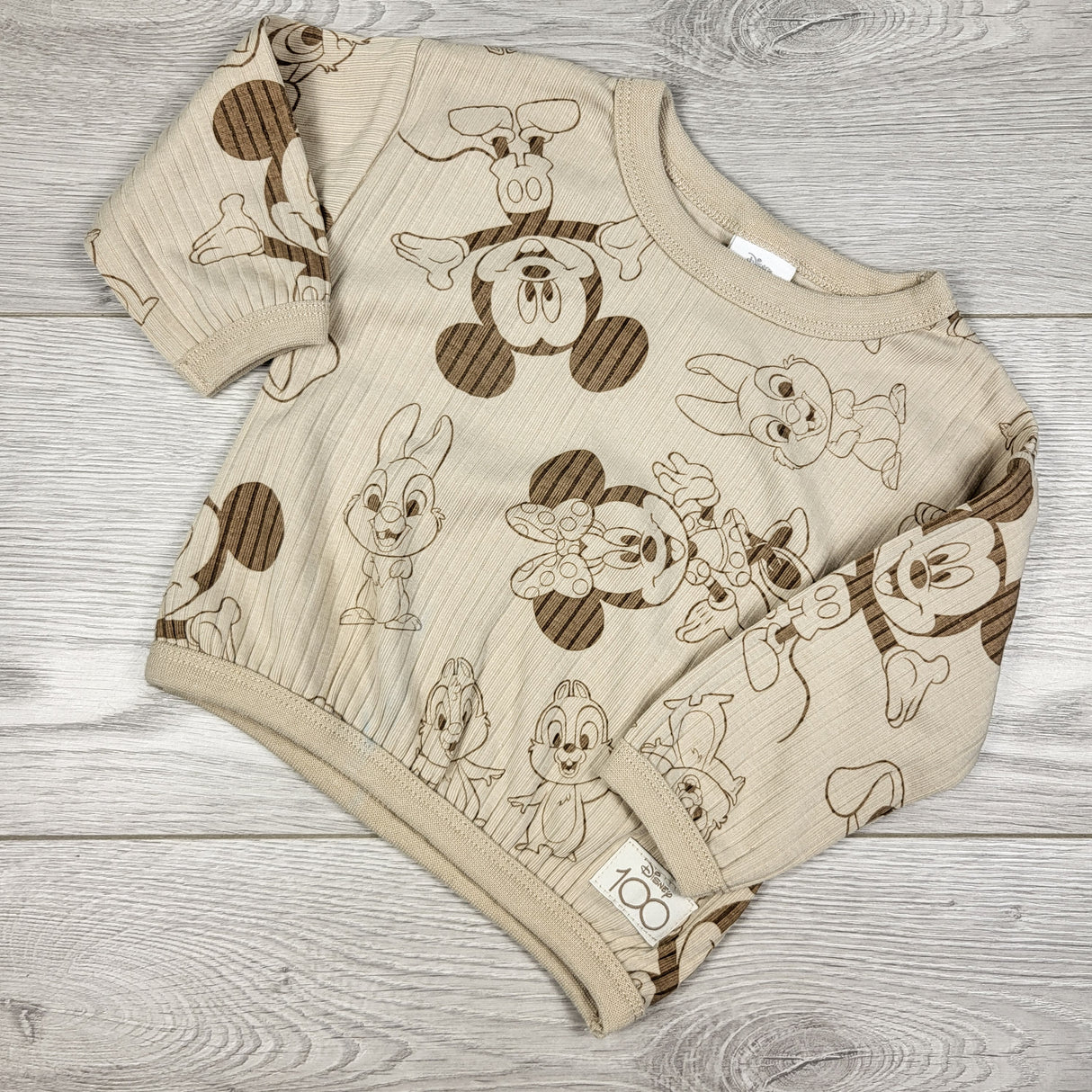 Disney beige ribbed long sleeve top. Size 0-3 months