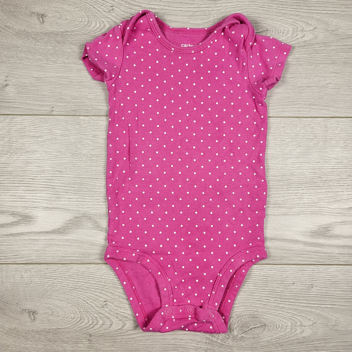 Carters pink polka dot bodysuit. Size 9 months