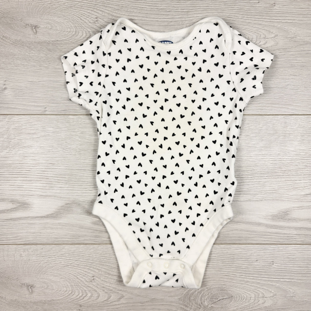 Old Navy white bodysuit with hearts. Size 6-12 months