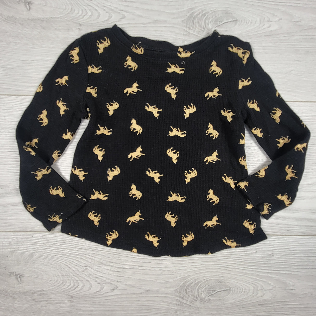 Old Navy black waffle print top with unicorns. Size 12-18 months