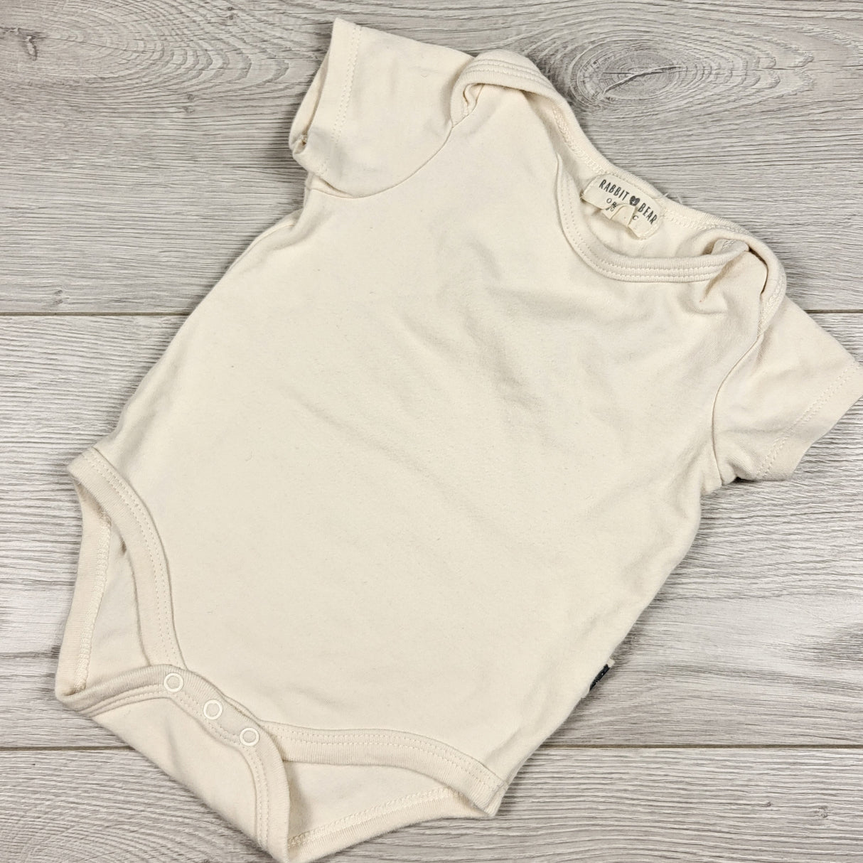 Rabbit + Bear beige bodysuit. Size 0-6 months