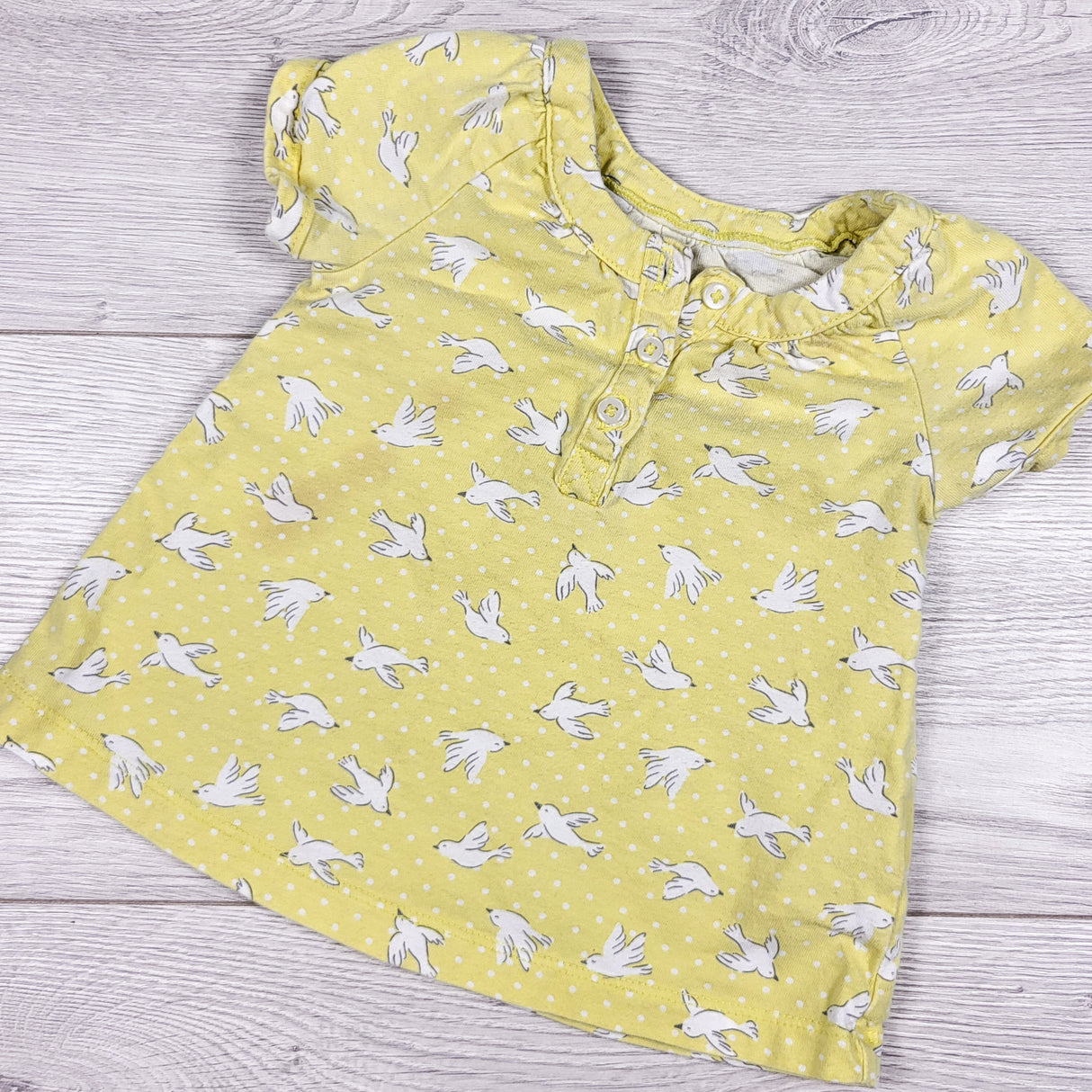 Carters yellow polka dot top with doves. Size 12 months