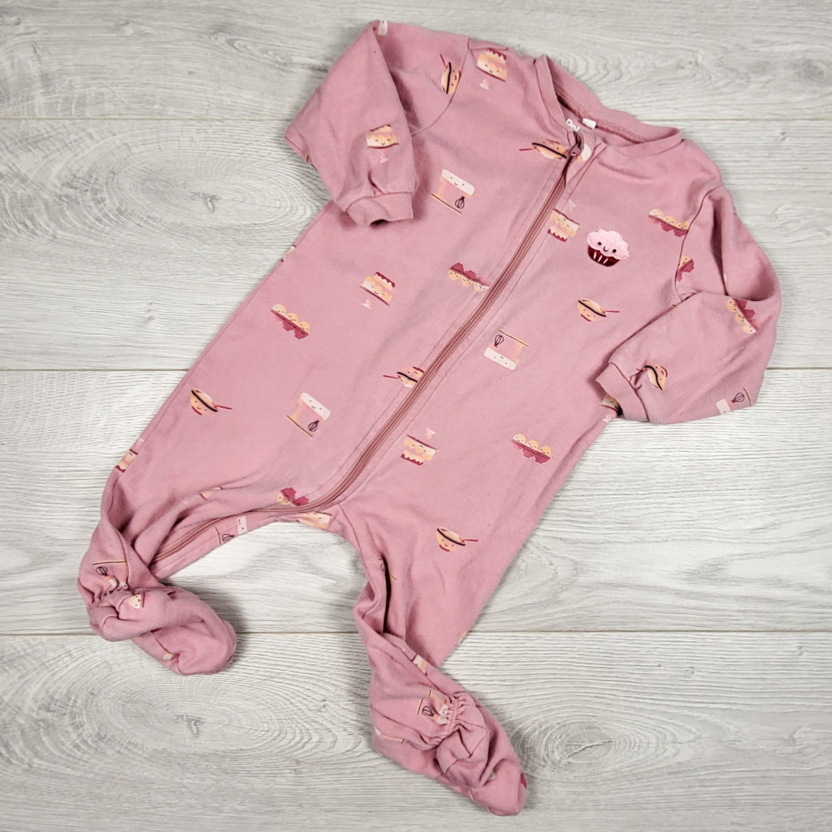 Pekkle pink zippered sleeper with baked treats. Size 9 months