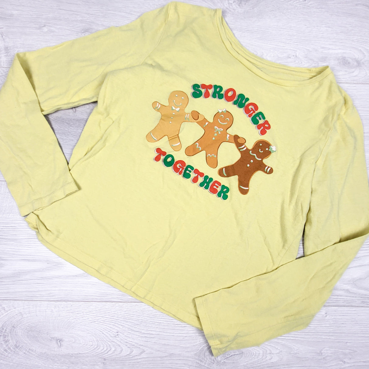 Old Navy yellow Gingerbread man shirt. Size 14/16