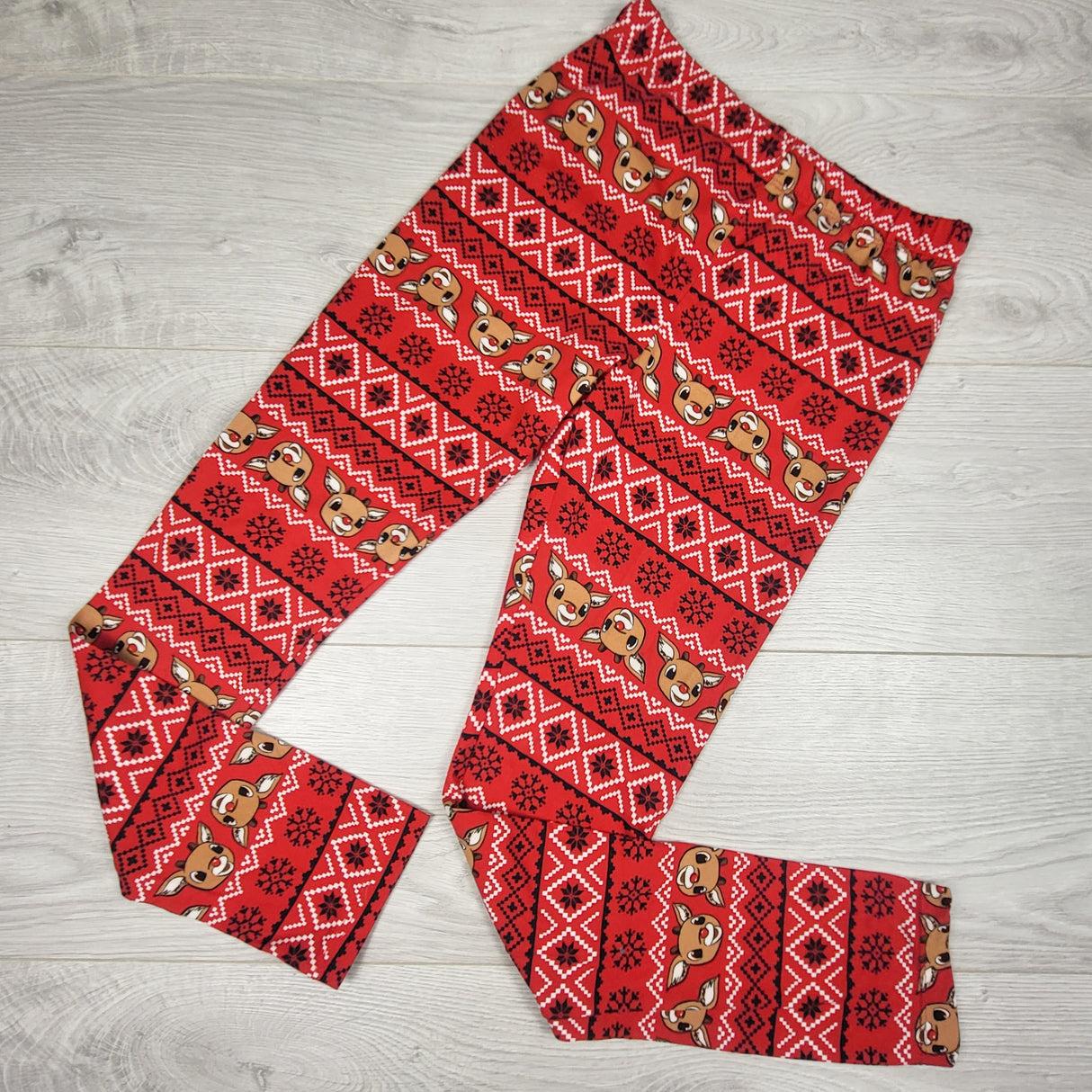 Red patterned Ruldolph leggings. Size 10/12