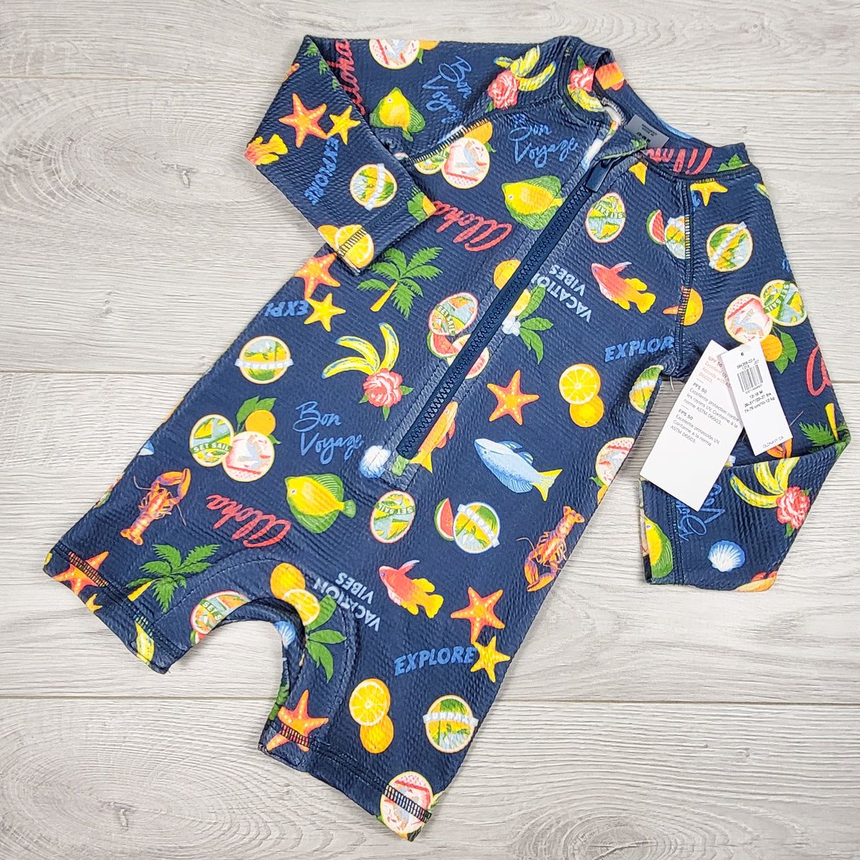 NEW - Old Navy blue one piece rash guard with tropical theme. Size 12-18 months