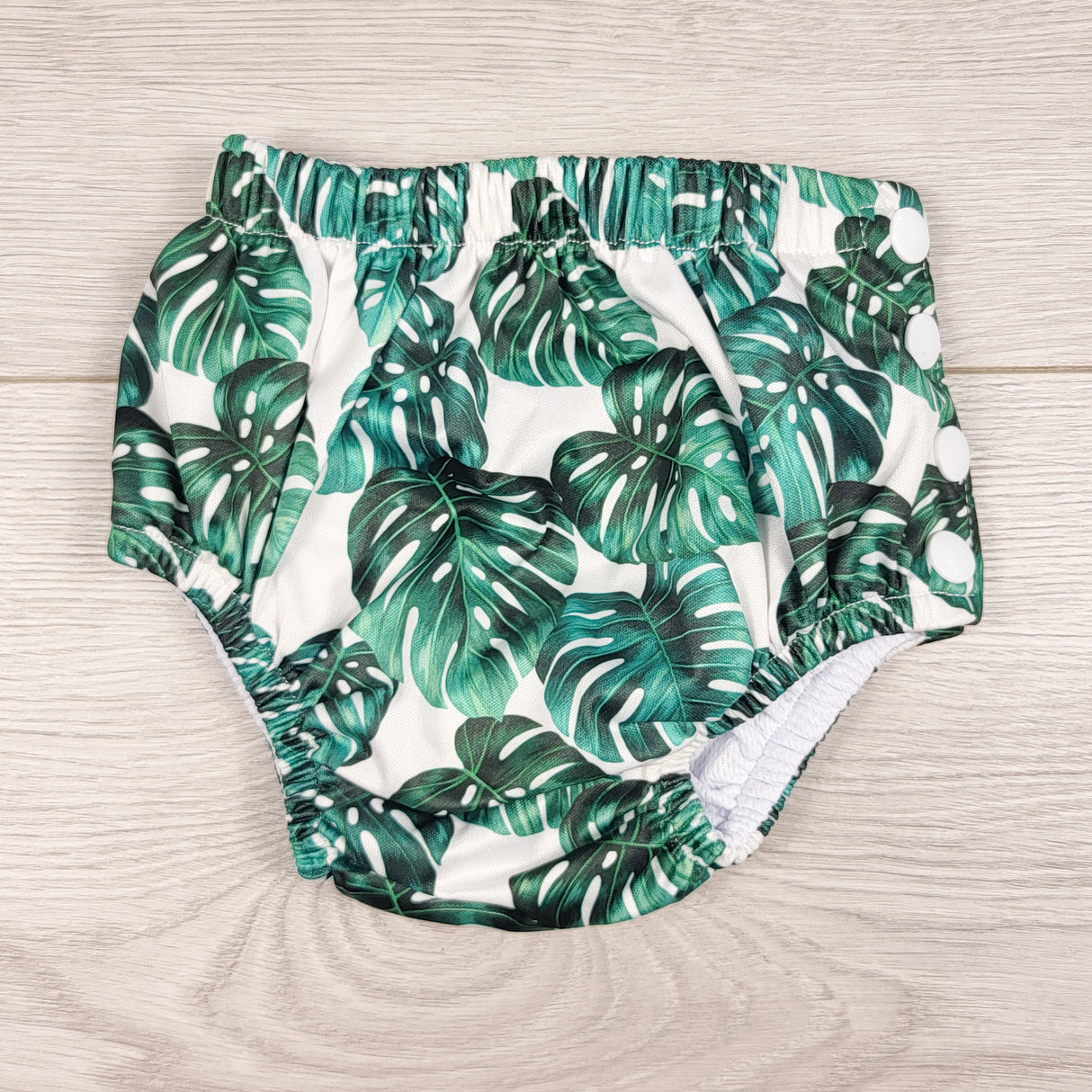 NWOT - Honeysuckle Swim Co. leaf print reusable swim diaper. Size medium (18-24 lbs)
