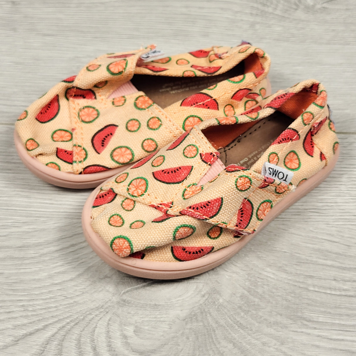 Toms peachy coloured canvas shoes with fruits. Size 5 (little kid)