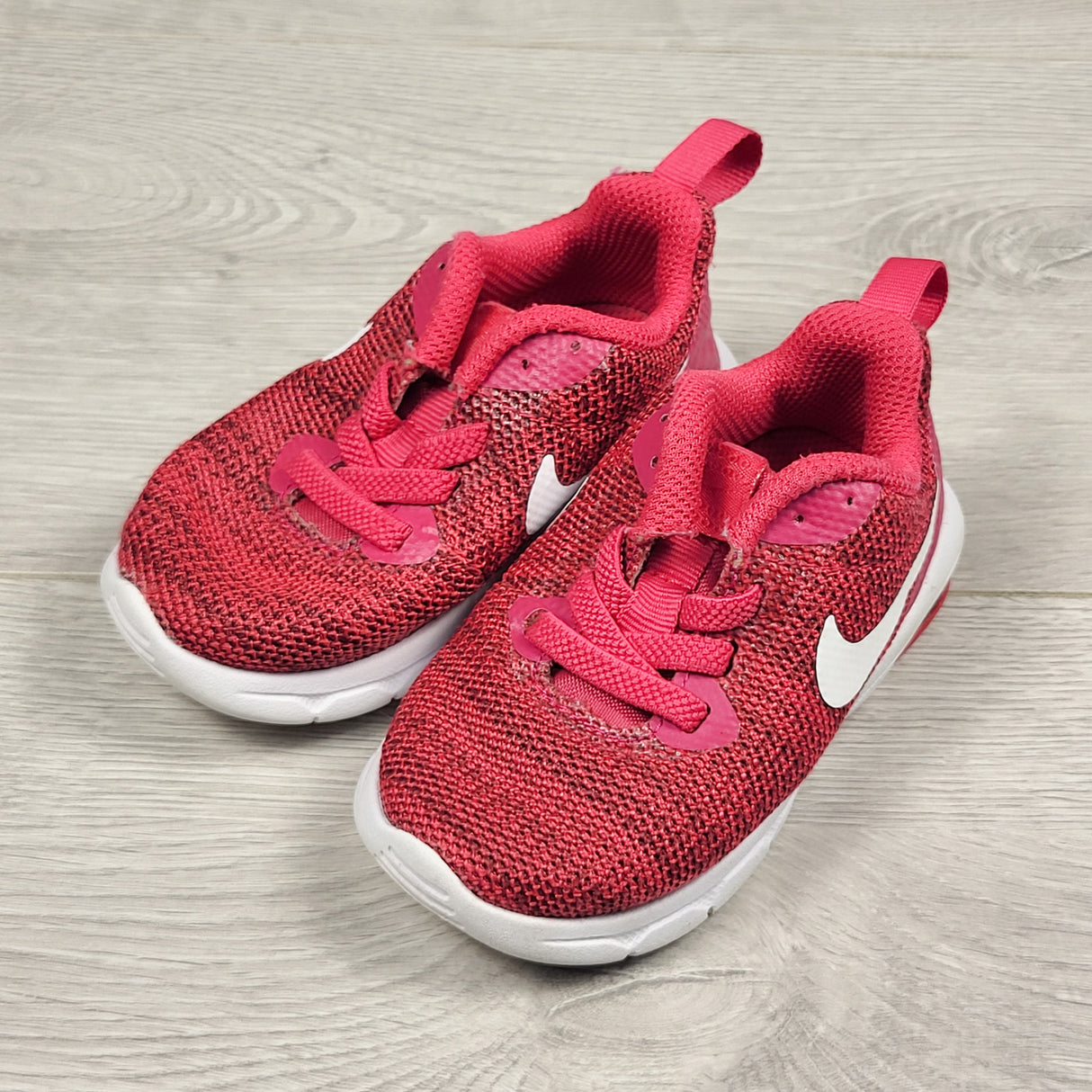 Nike pinky-red running shoes. Size 5 (little kid)