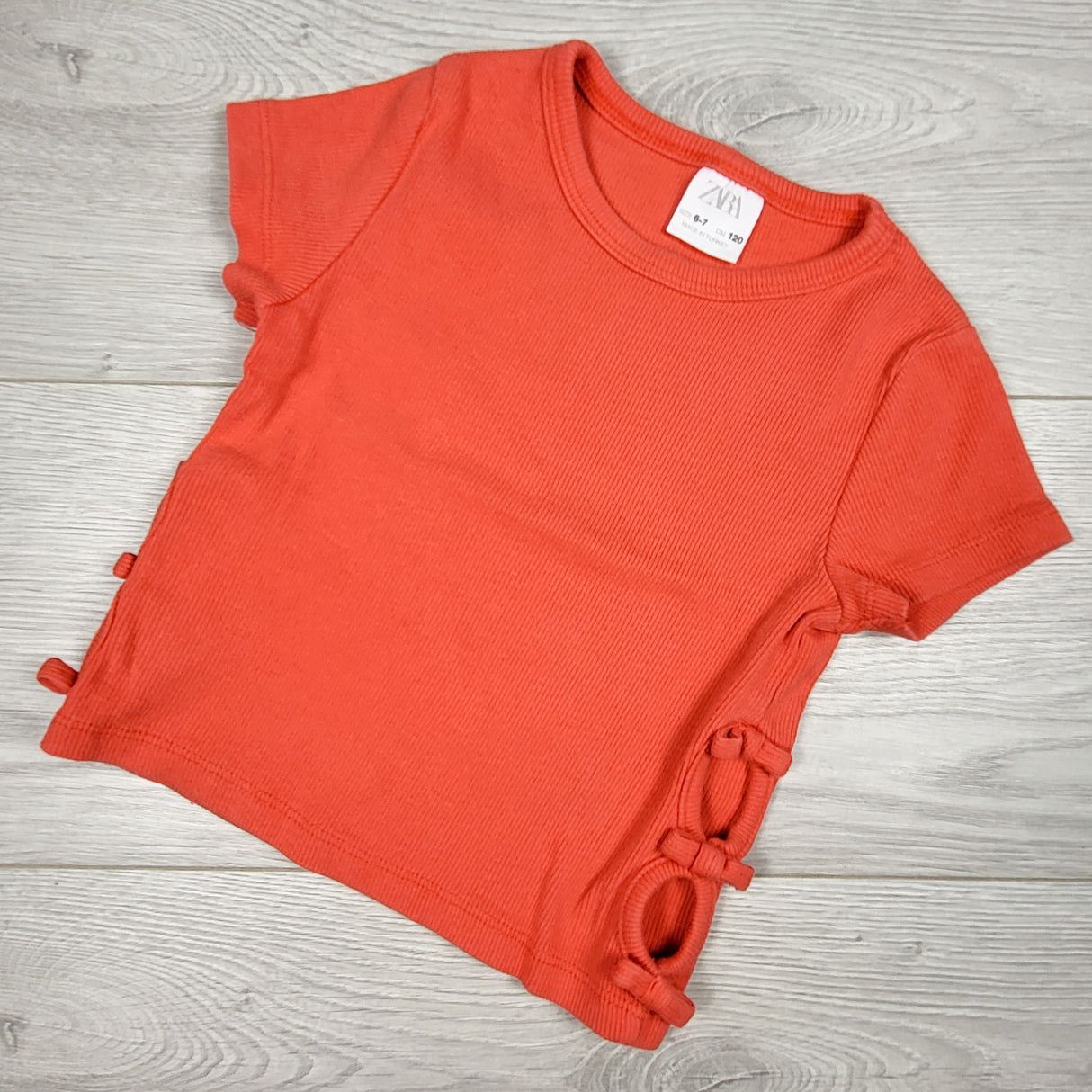 Zara coral-pink ribbed t-shirt with side cut-outs. Size 6/7