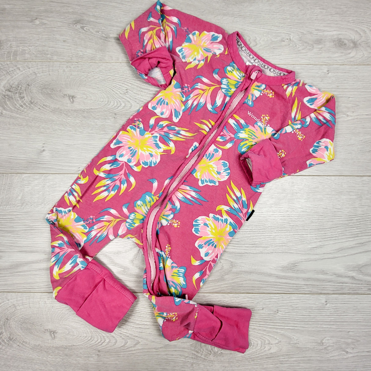 Bonds pink floral print wondersuit. Size 6-12 months
