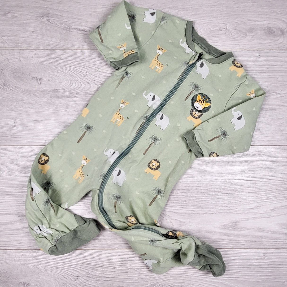 Tuffy green zippered sleeper with safari animals. Size 9 months