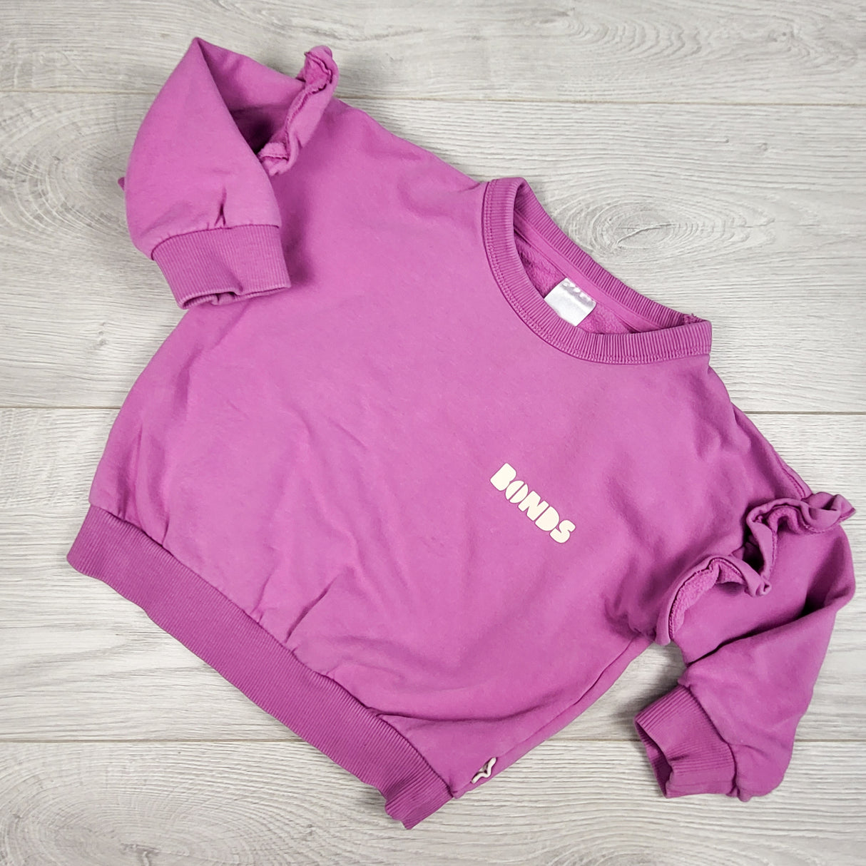 Bonds pink "Tech Sweat" ruffle sweatshirt. Size 12-18 months
