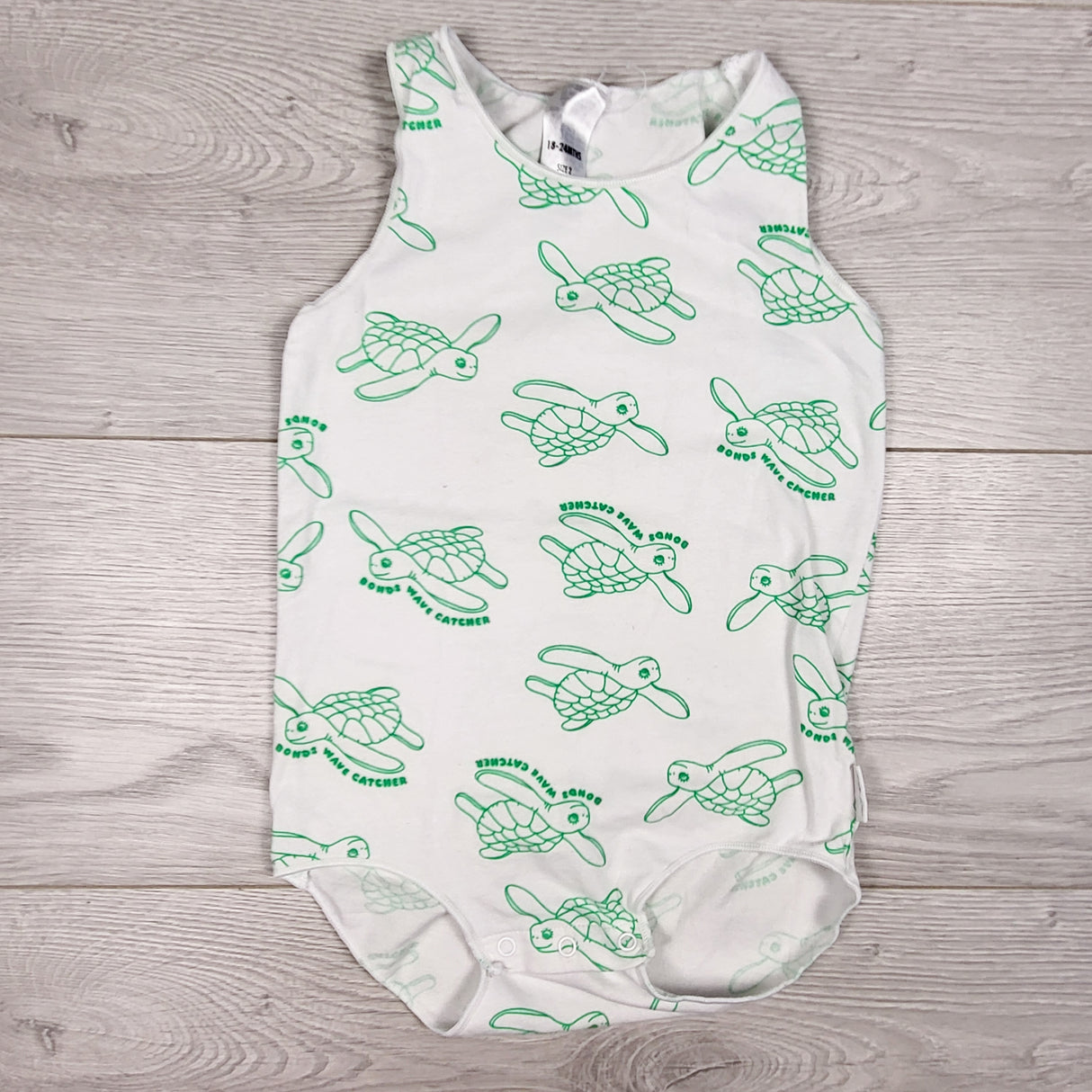 Bonds white turtle print tank style bodysuit. Size 18-24 months