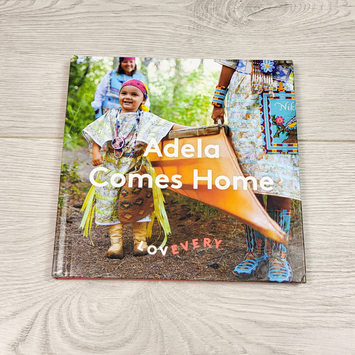 Lovevery hardcover "Adela Comes Home" book