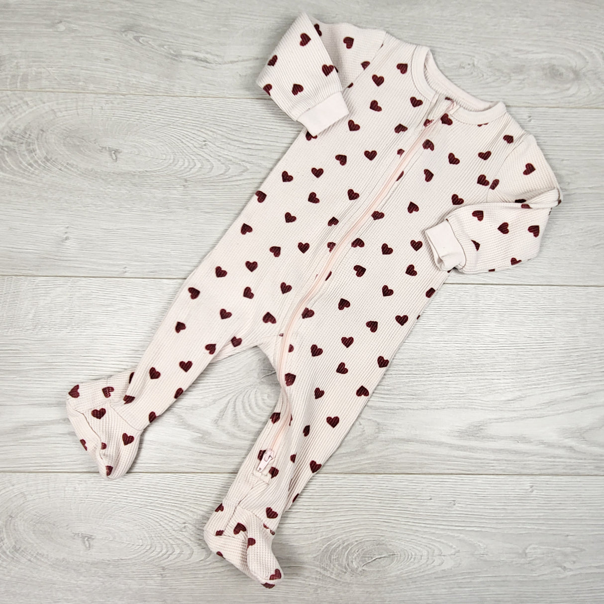 Petit Lem pale pink waffle knit sleeper with hearts. Size 6 months