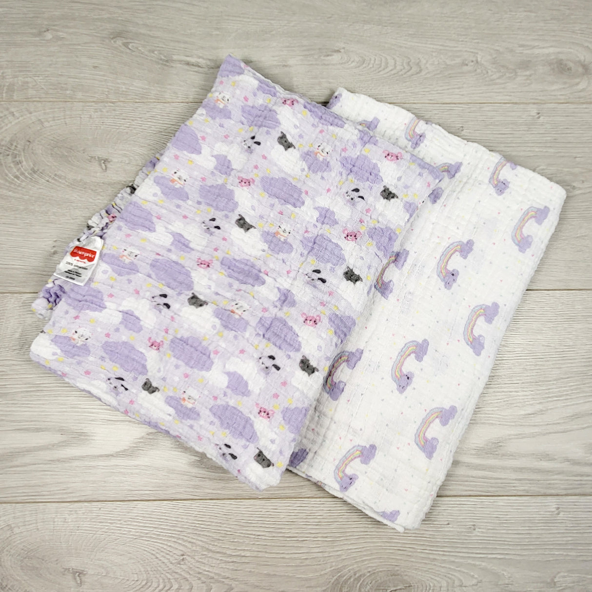 Pair of muslin swaddles with rainbows