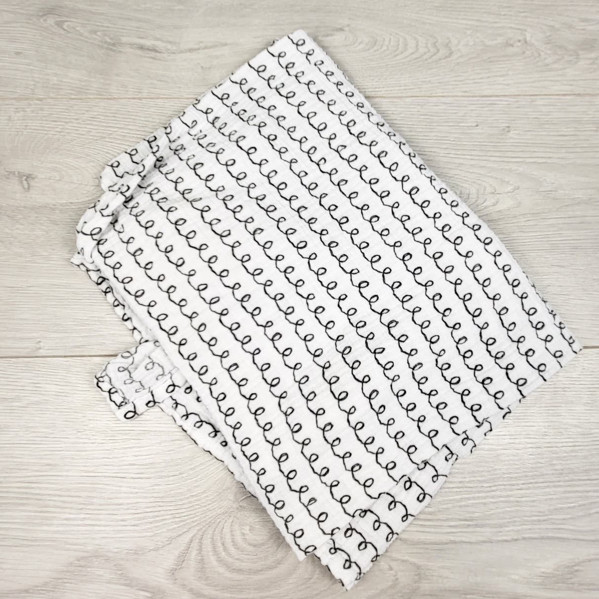 Summer squiggle pattern muslin swaddle