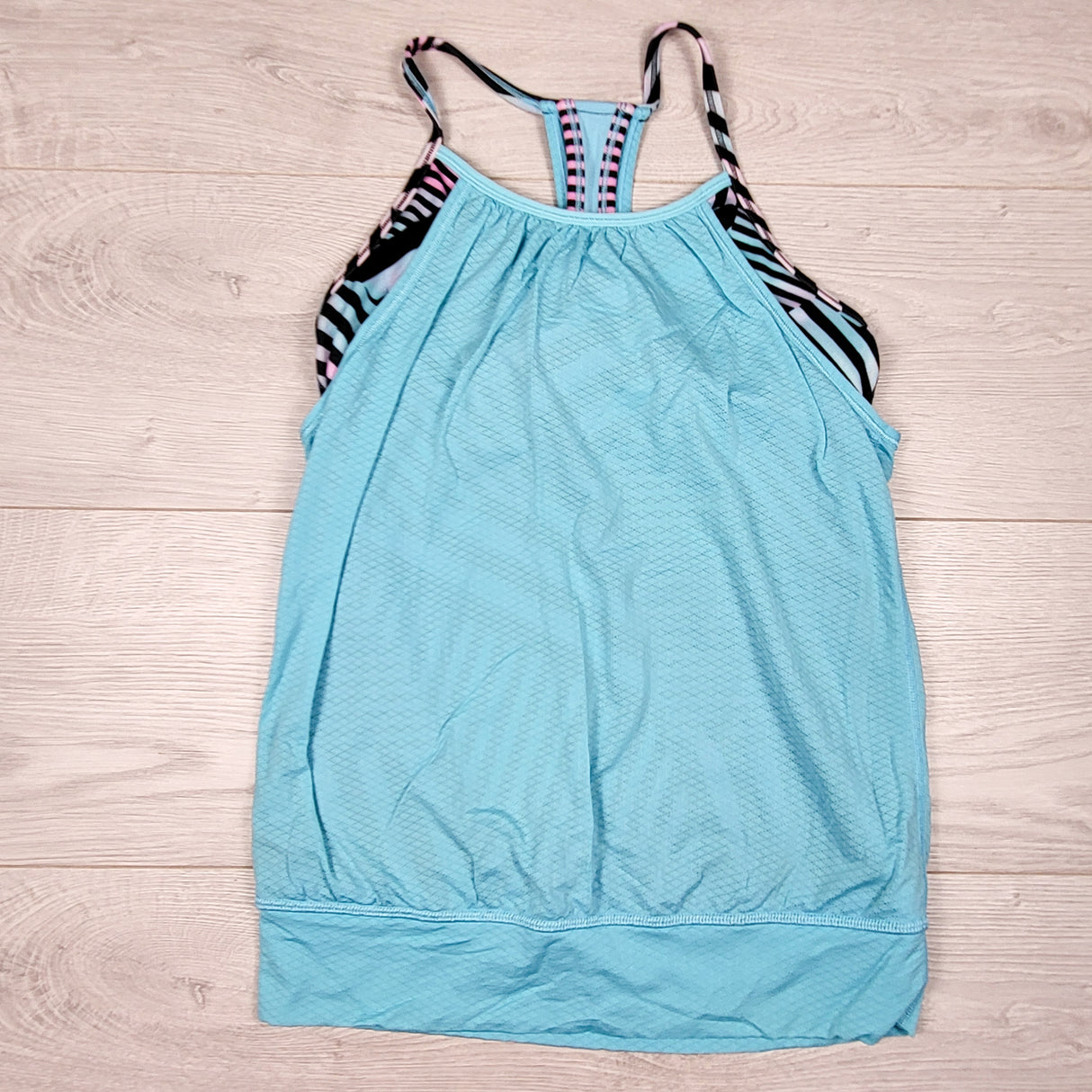 Ivivva (Lululemon) light blue double dutch tank with built in shelf bra. Size 10