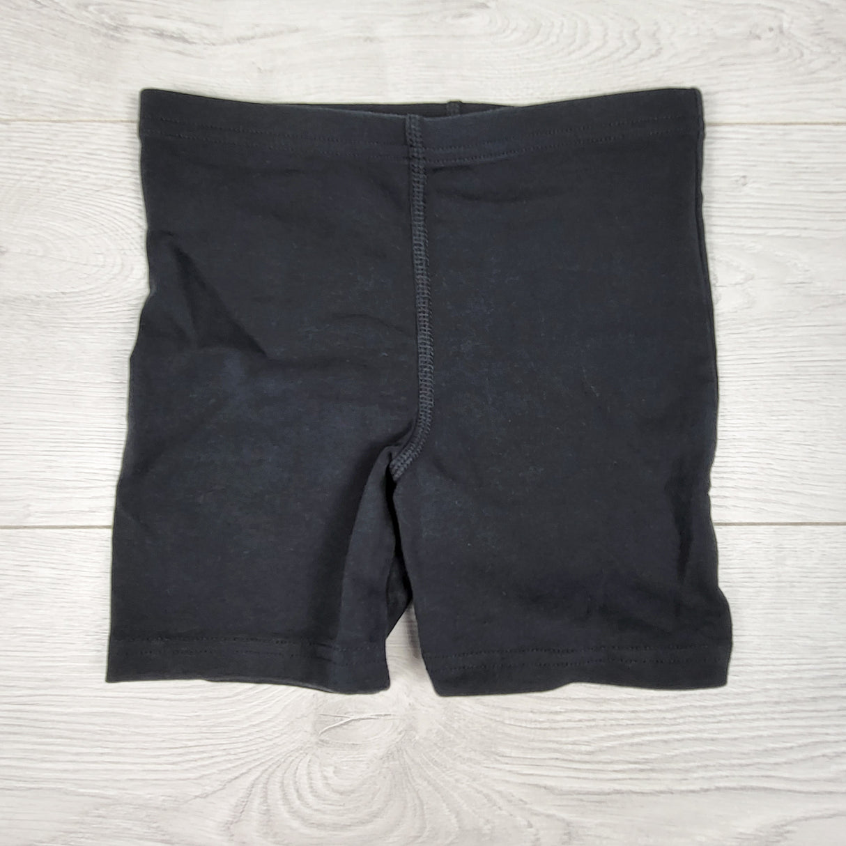 Peekaboo Beans black bicycle shorts. Size 7