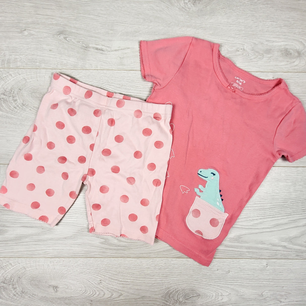 Carters pink 2pc PJs with dinosaur. Size 6