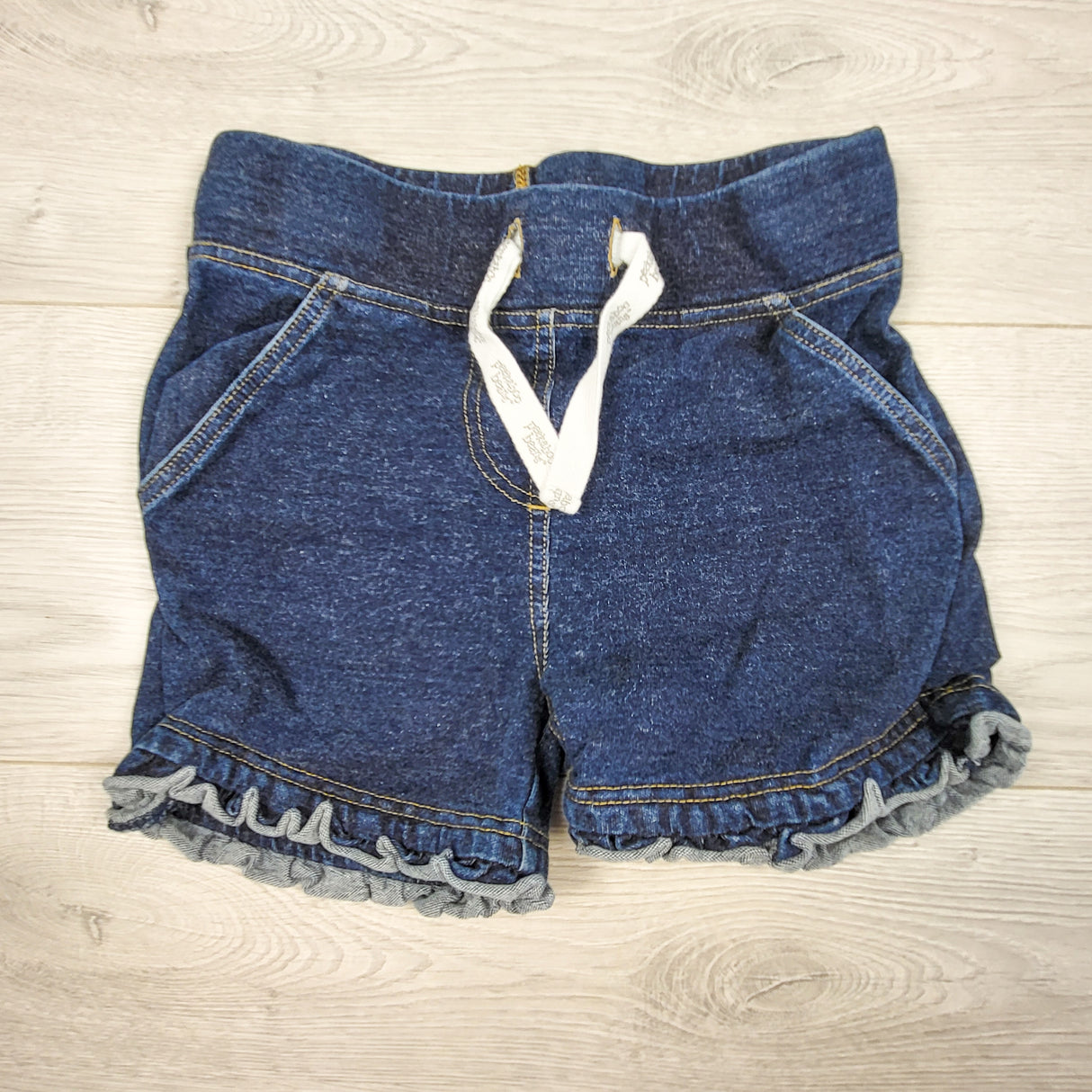Peekaboo Beans denim look stretchy ruffle shorts. Size 7