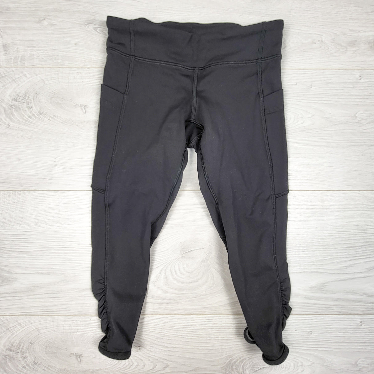 Ivivva (Lululemon) black "Quick Trips Crops" capri active leggings. Size 7