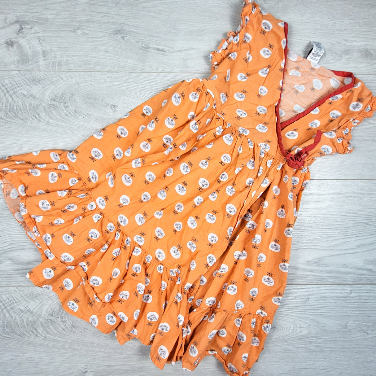 Tea Collection orange patterned wrap dress. Size 6