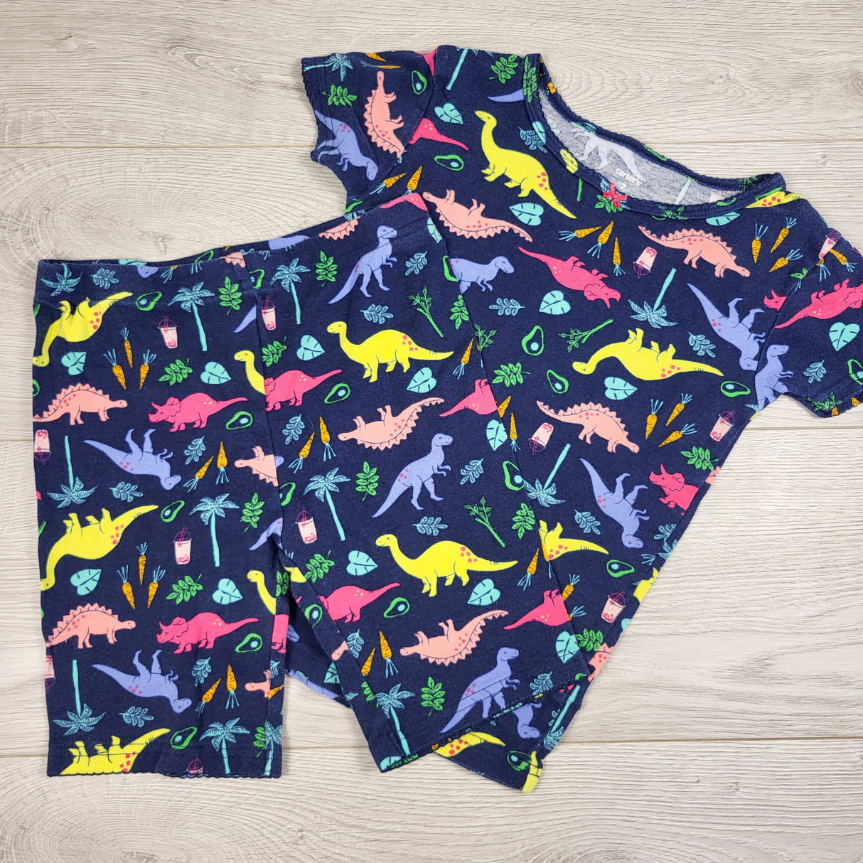 Carters navy 2pc cotton PJs with dinosaurs. Size 7