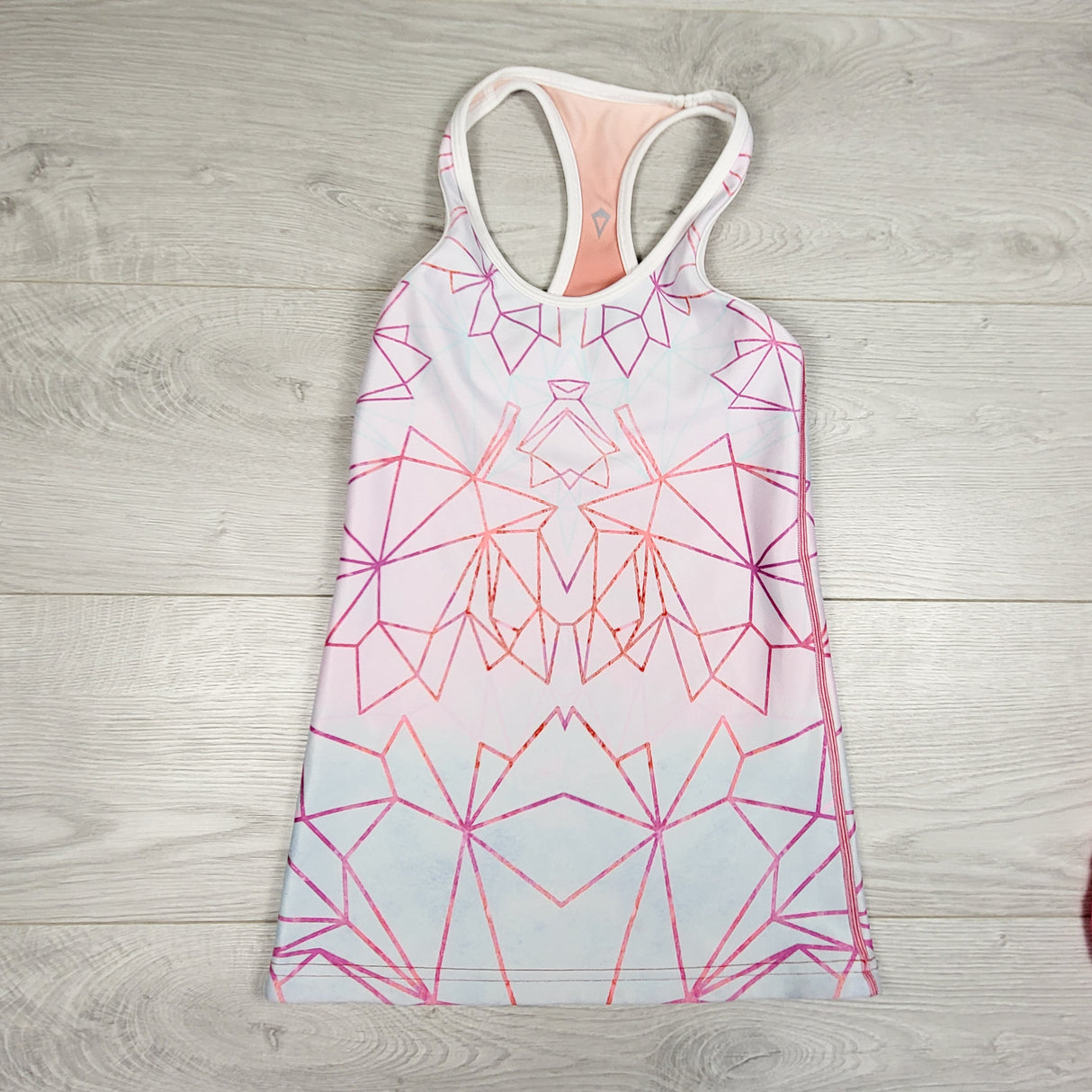 Ivivva (Lululemon) reversible racerback tank with maple leaves. Sizes like a 10