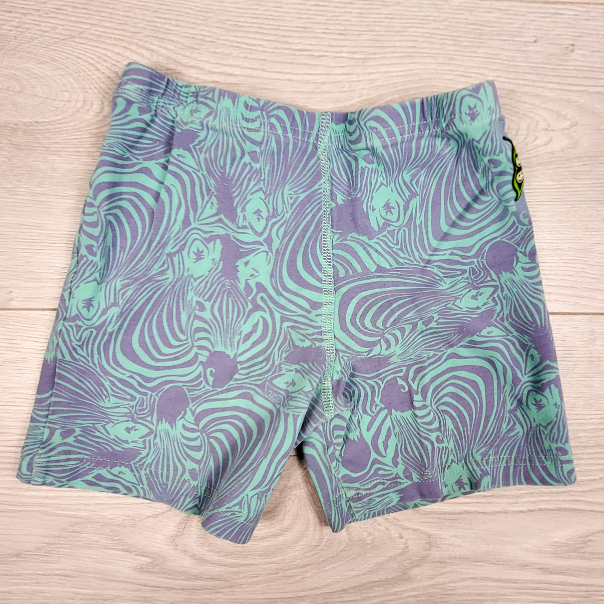 Peekaboo Beans turquoise and purple zebra print bike shorts. Size 7