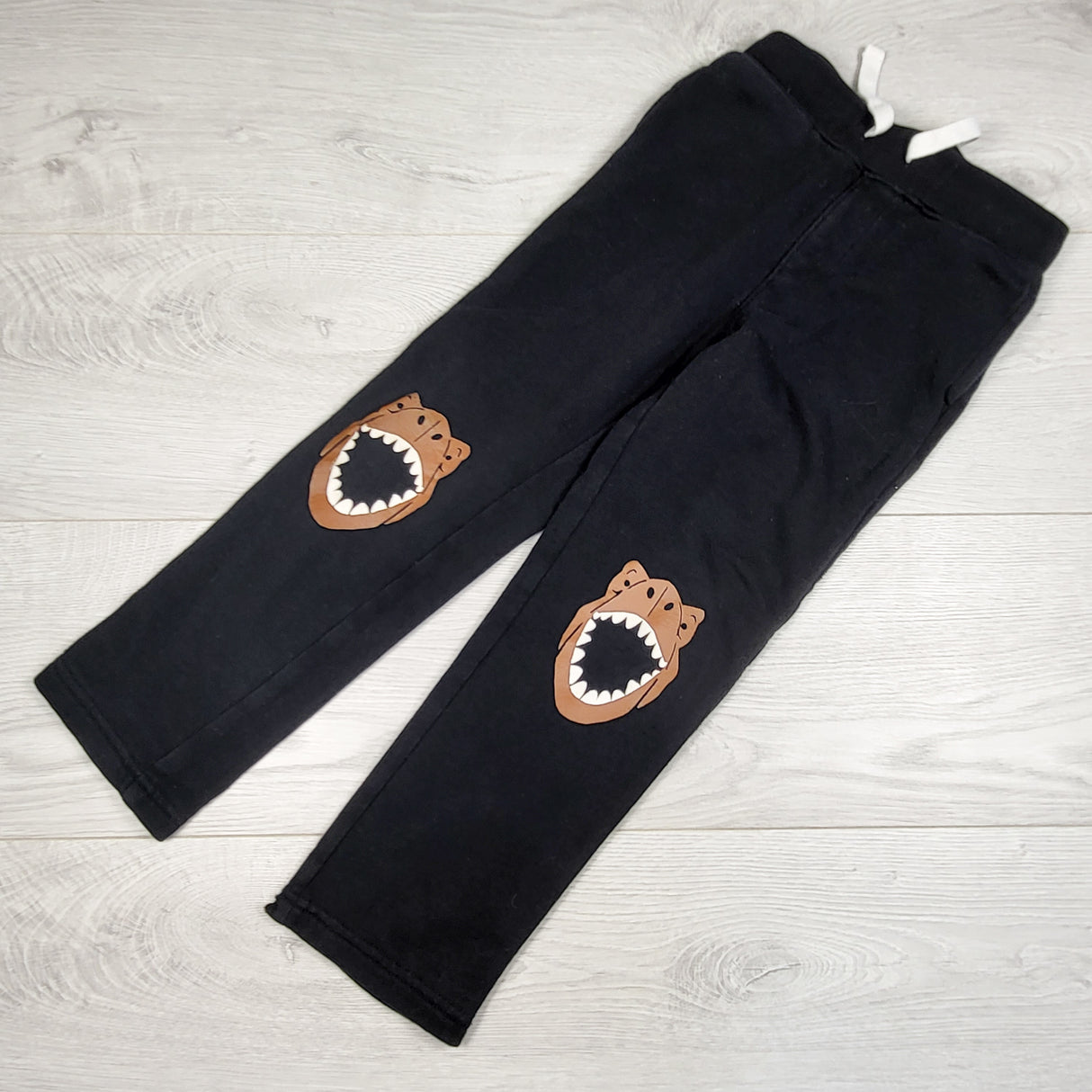 Old Navy black sweat pants with dinosaurs. Size 5T
