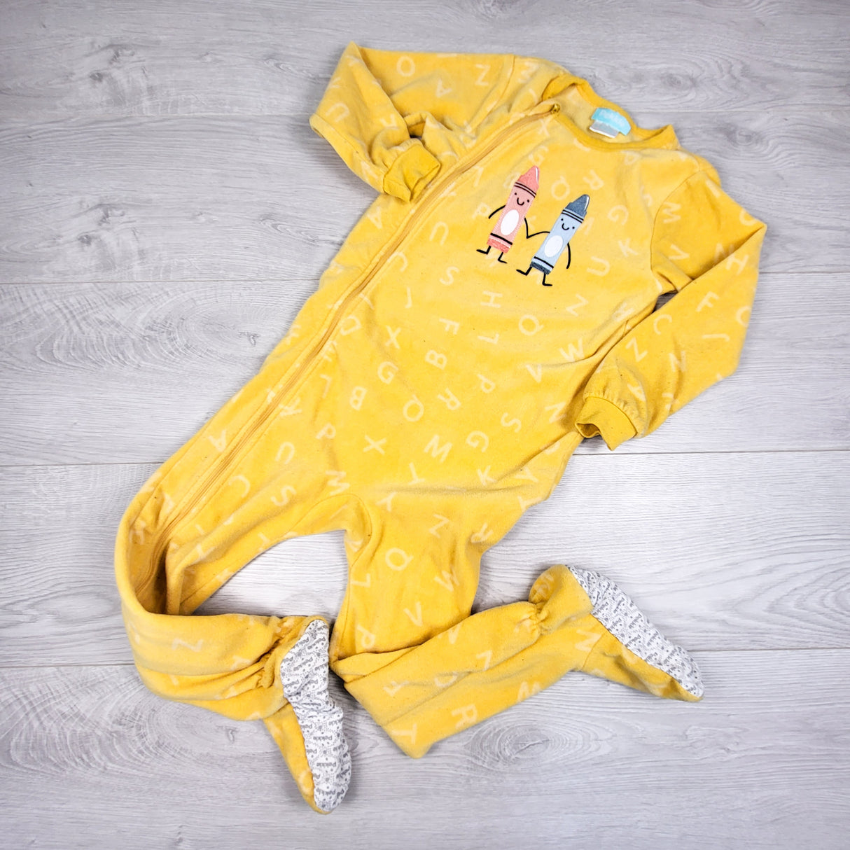 Pekkle yellow zippered fleece sleeper with crayons. Size 5T