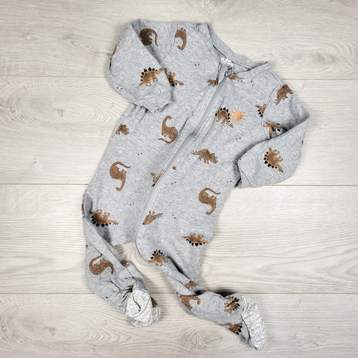 Pekkle grey zippered sleeper with dinosaurs. Size 12 months