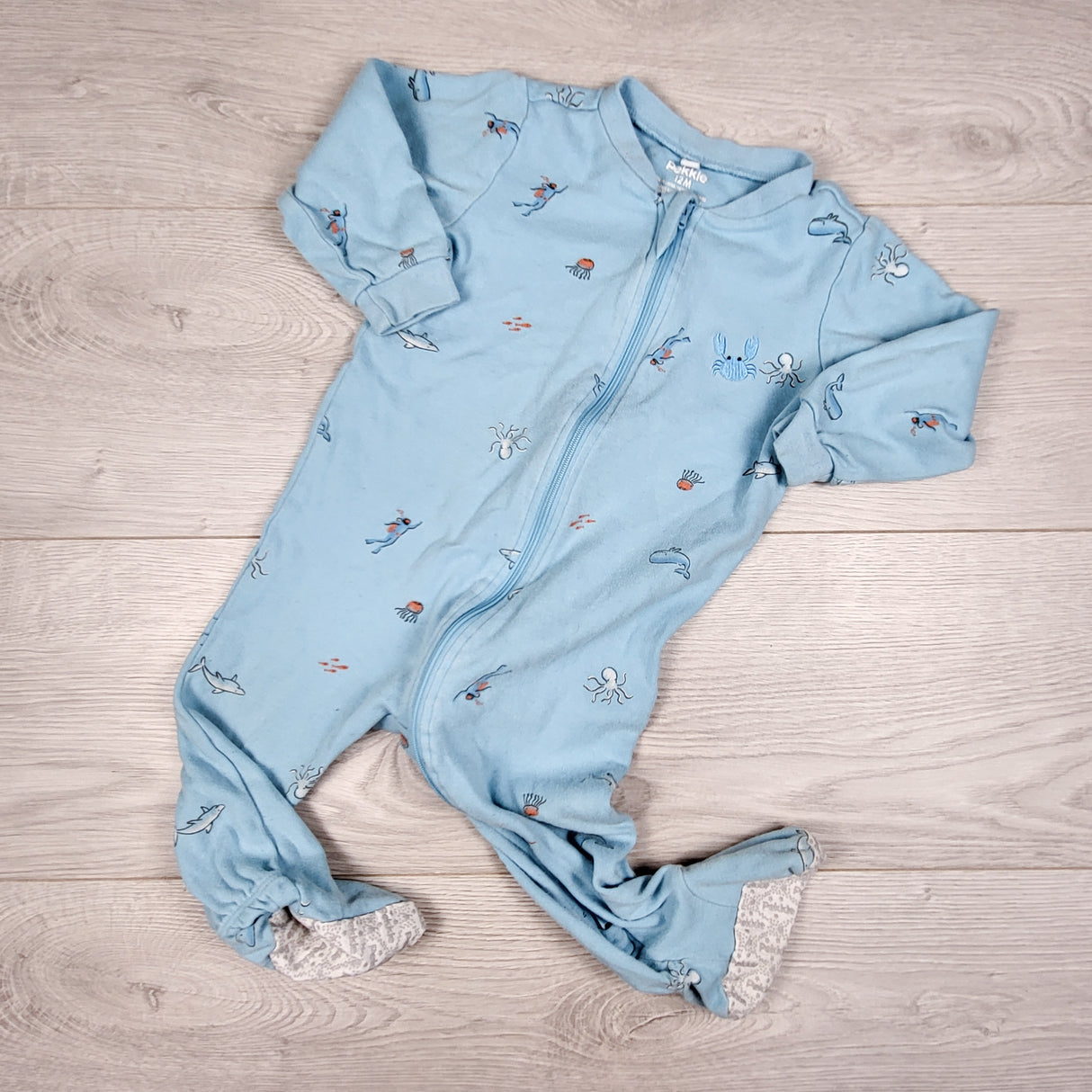 Pekkle blue zippered sleeper with underwater theme. Size 12 months