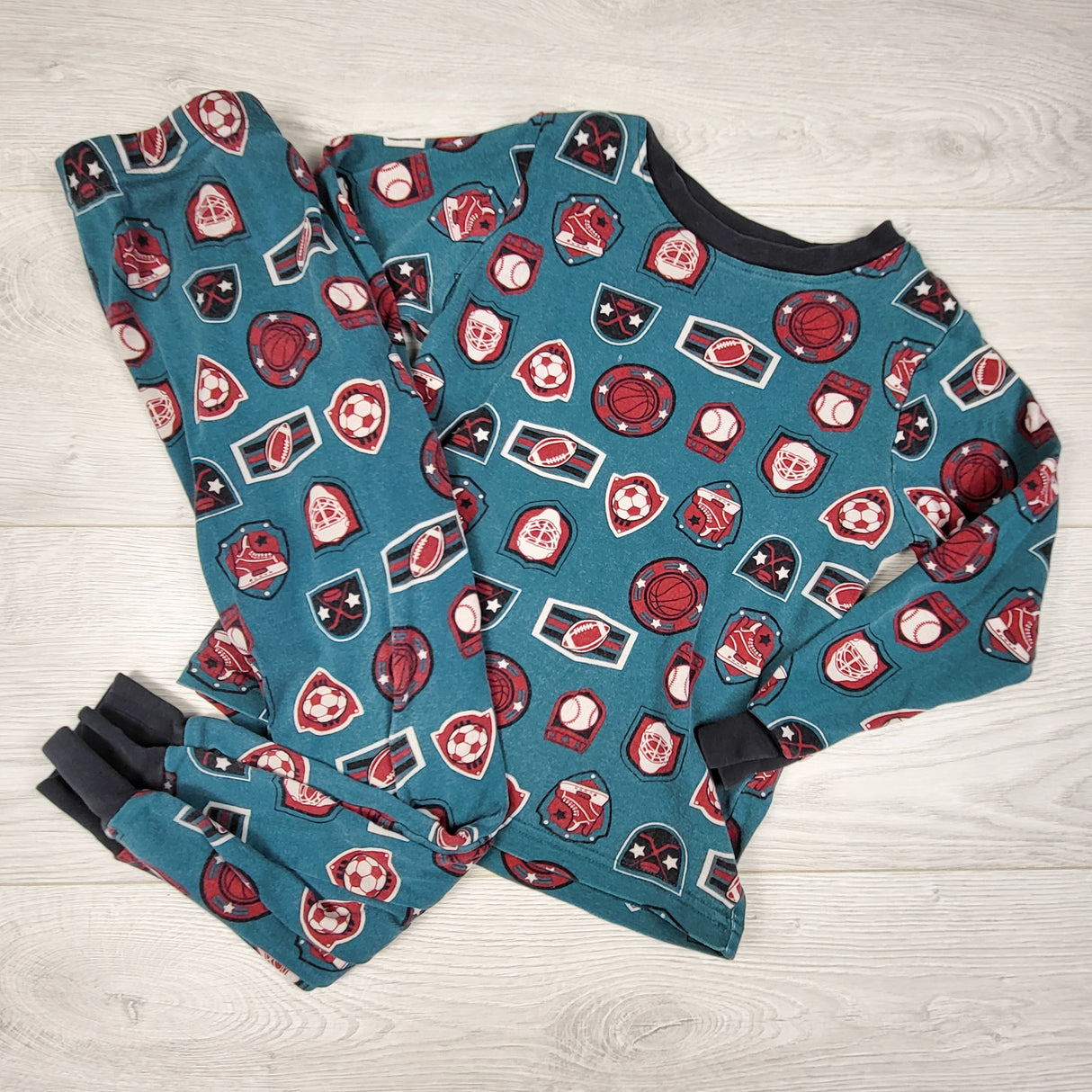 Kirkland teal 2pc sports themed PJs. Size 6