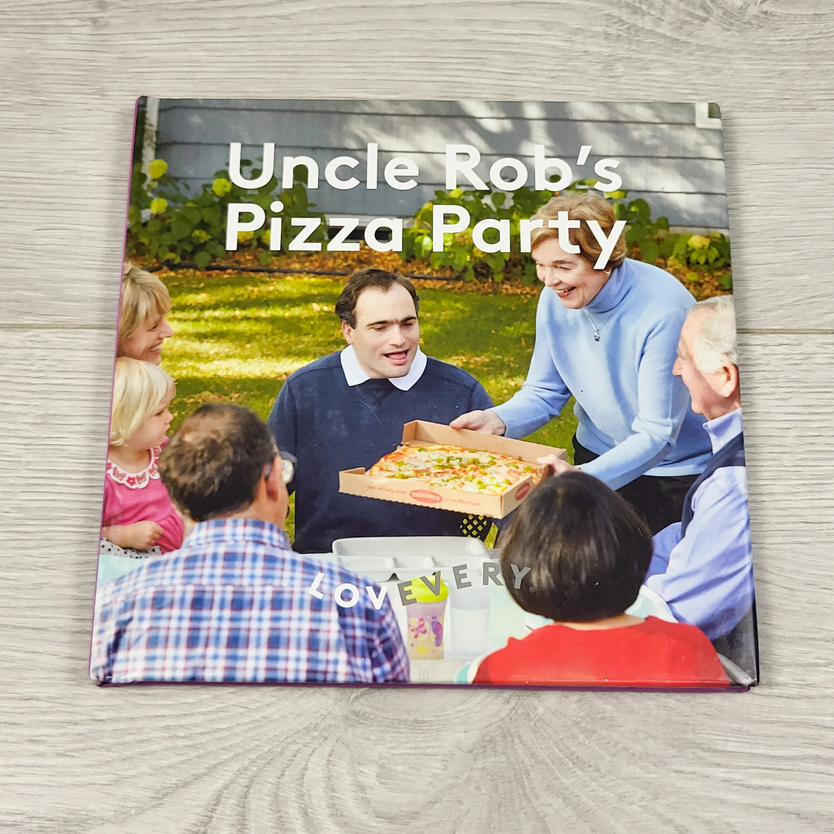 Uncle Rob's Pizza Party. Hardcover Lovevery book