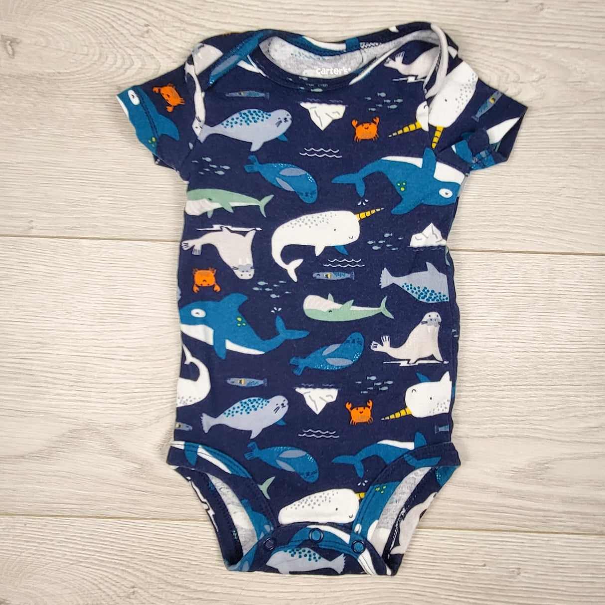 Carters navy bodysuit with whales. Size 6 months
