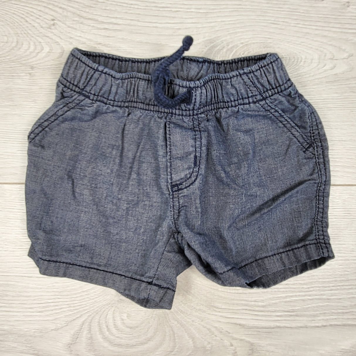 Old Navy blue denim look drawstring shorts. Size 3-6 months