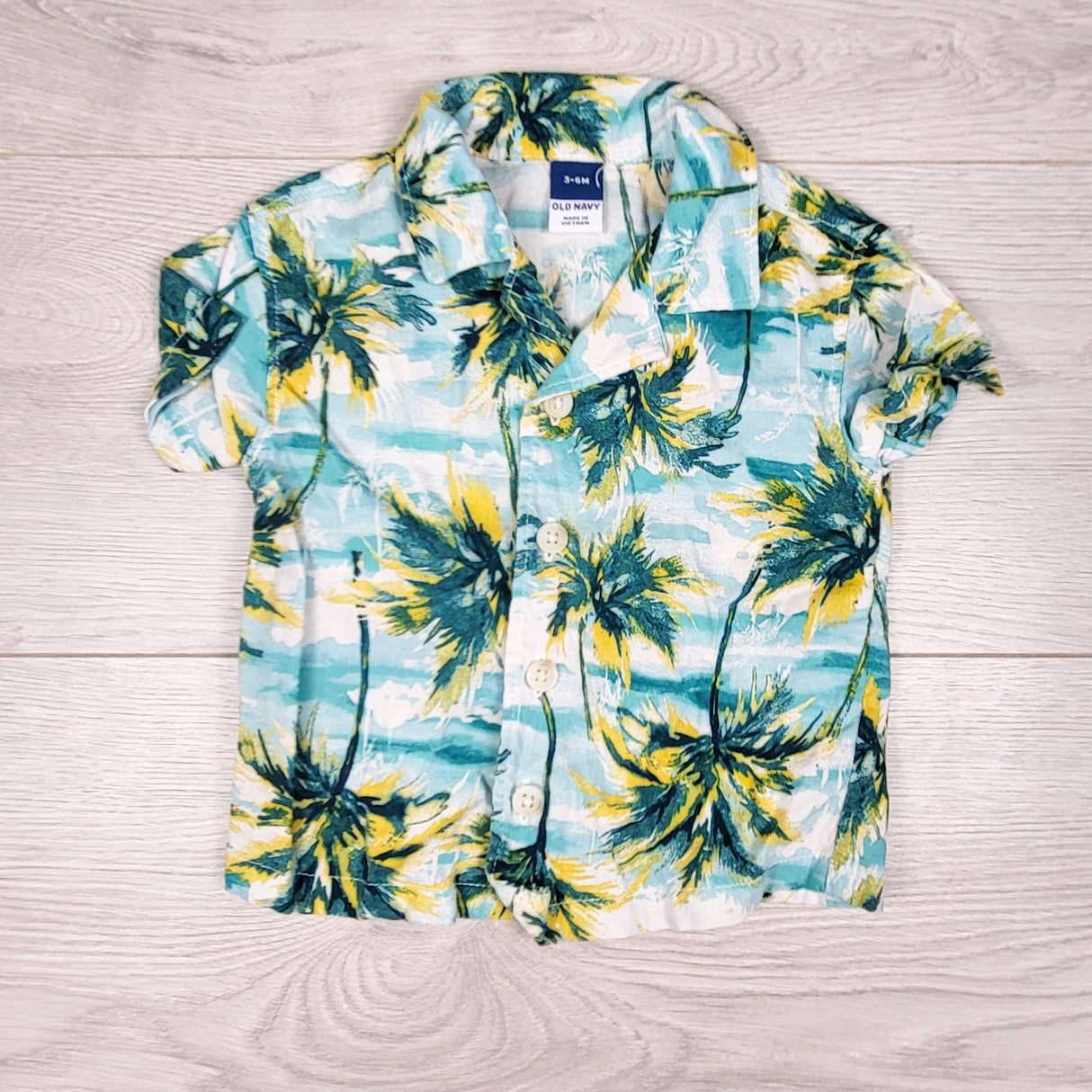 Old Navy button down palm tree shirt. Size 3-6 months