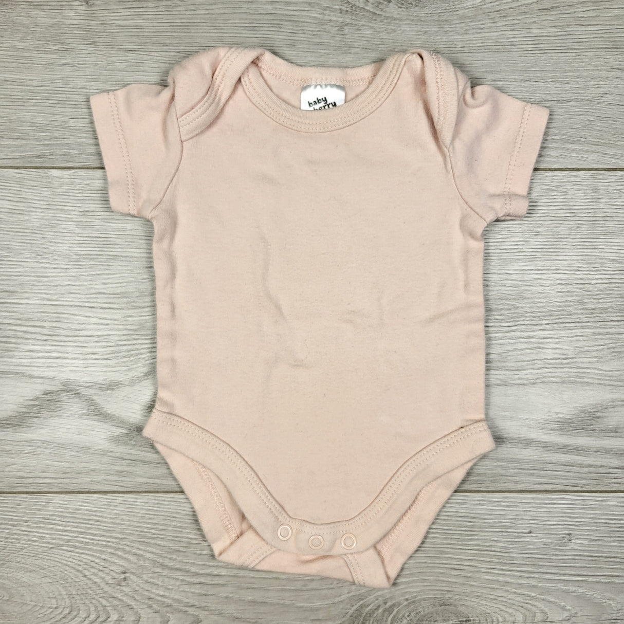 Baby Berry light pink bodysuit. Size 0-3 months